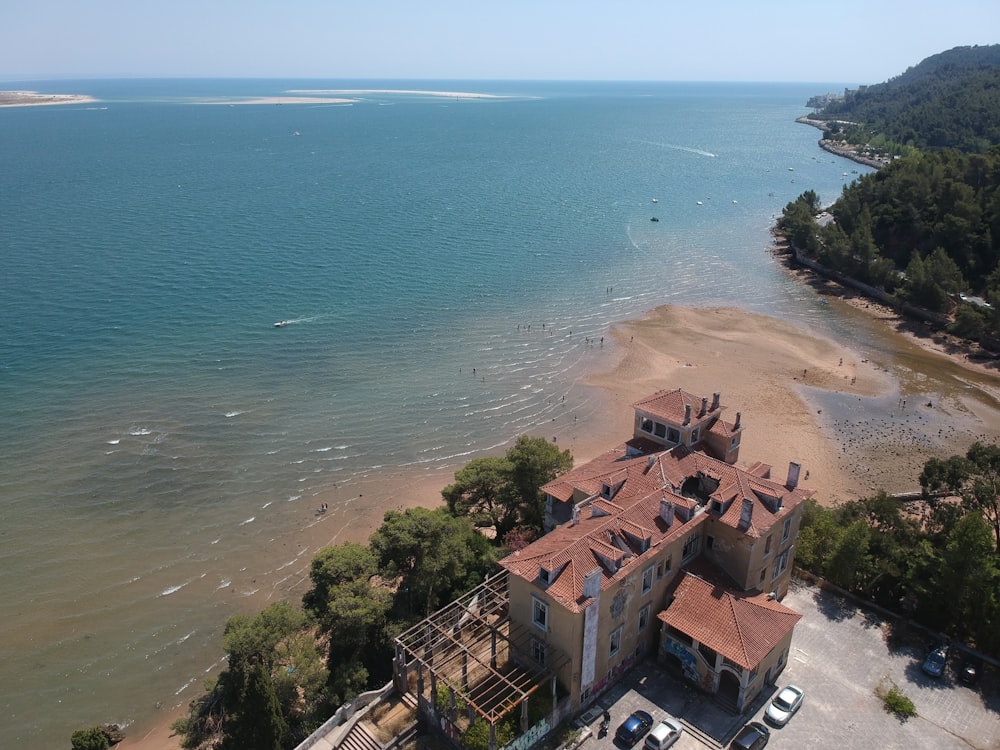 an aerial view of a house on the beach