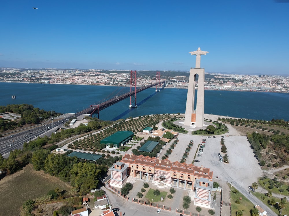 an aerial view of a city with a bridge in the background