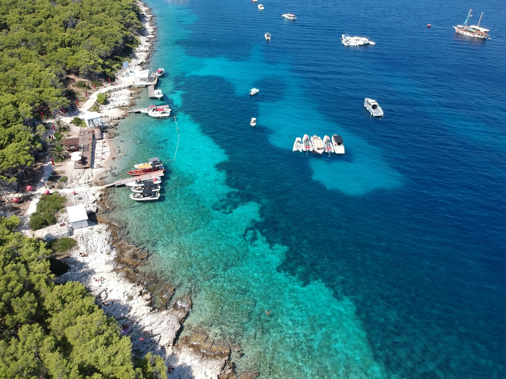 a group of boats floating on top of a body of water