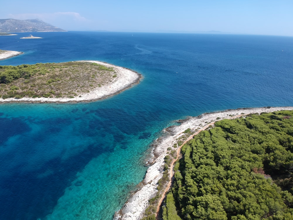 an aerial view of an island in the middle of the ocean