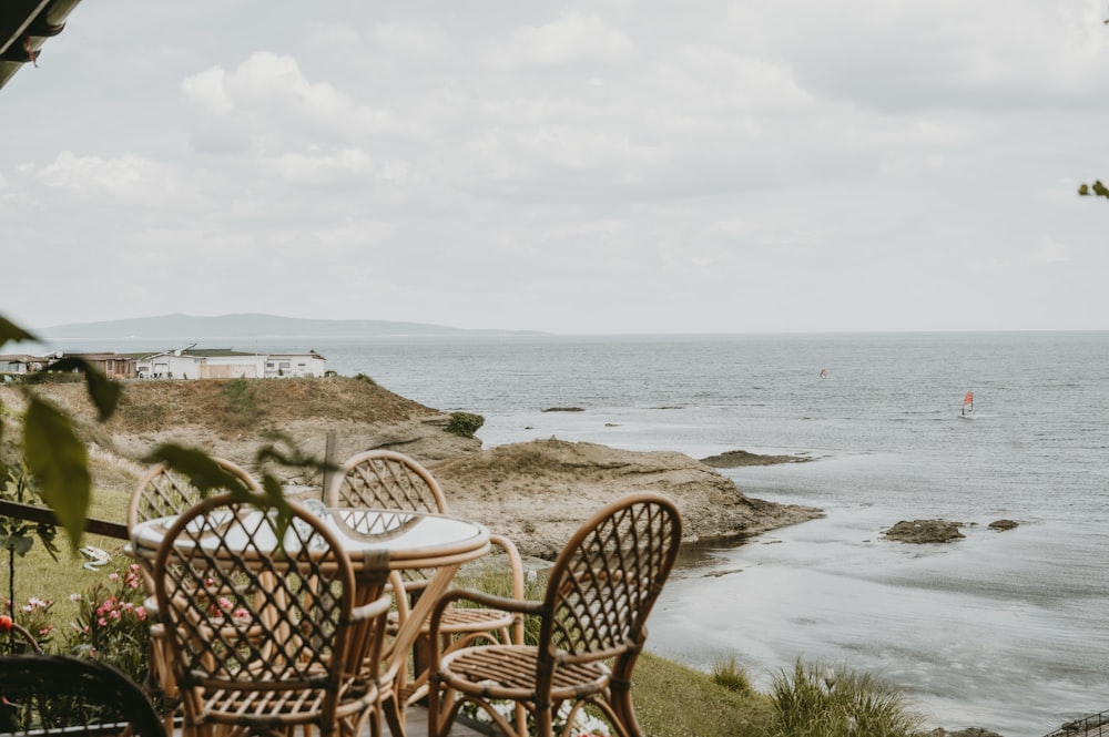 a couple of chairs sitting on top of a wooden table