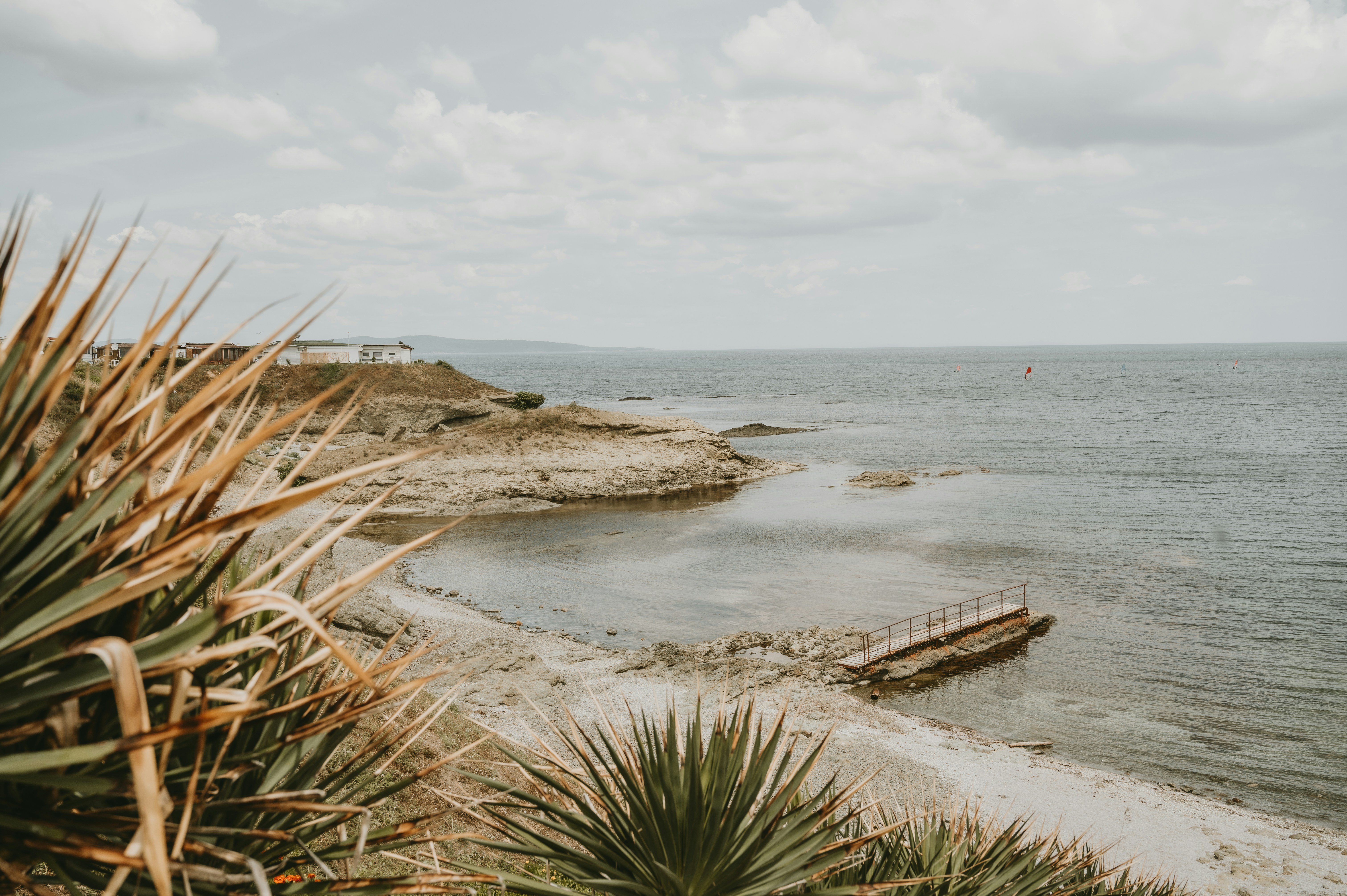 a view of a beach with a boat in the water, 