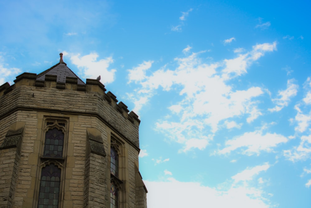 a tall tower with a cross on top of it