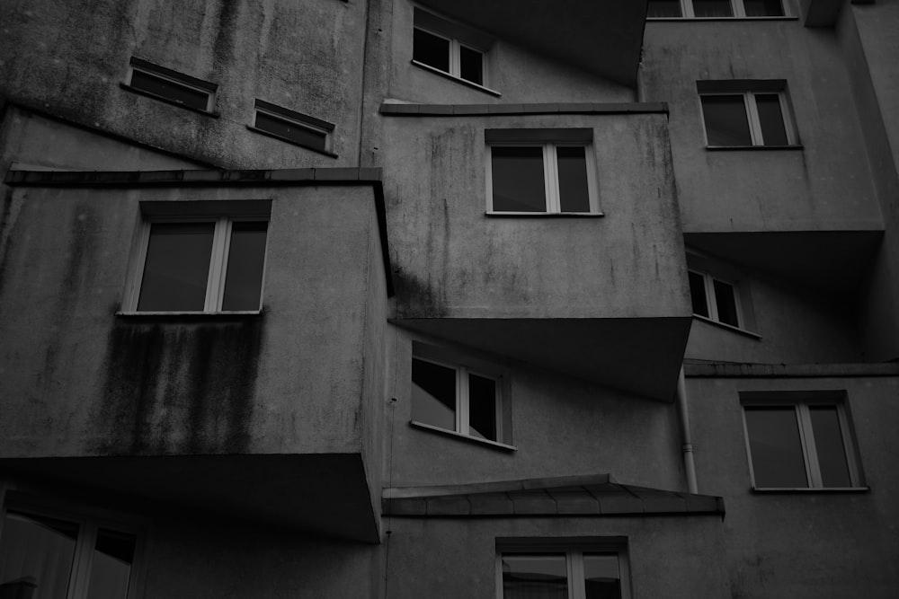 a black and white photo of a building with windows