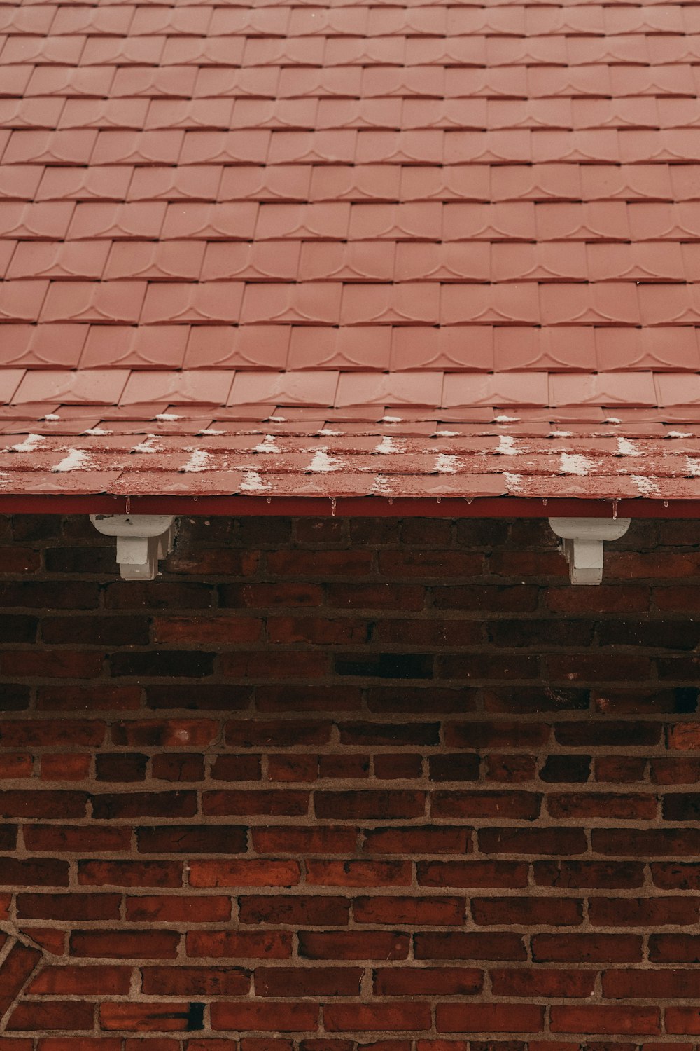 a red brick building with a clock on the side of it