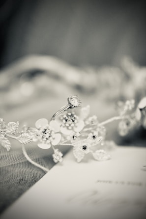 A radiant bride with a delicate floral hairpiece styled by lalaboudette.