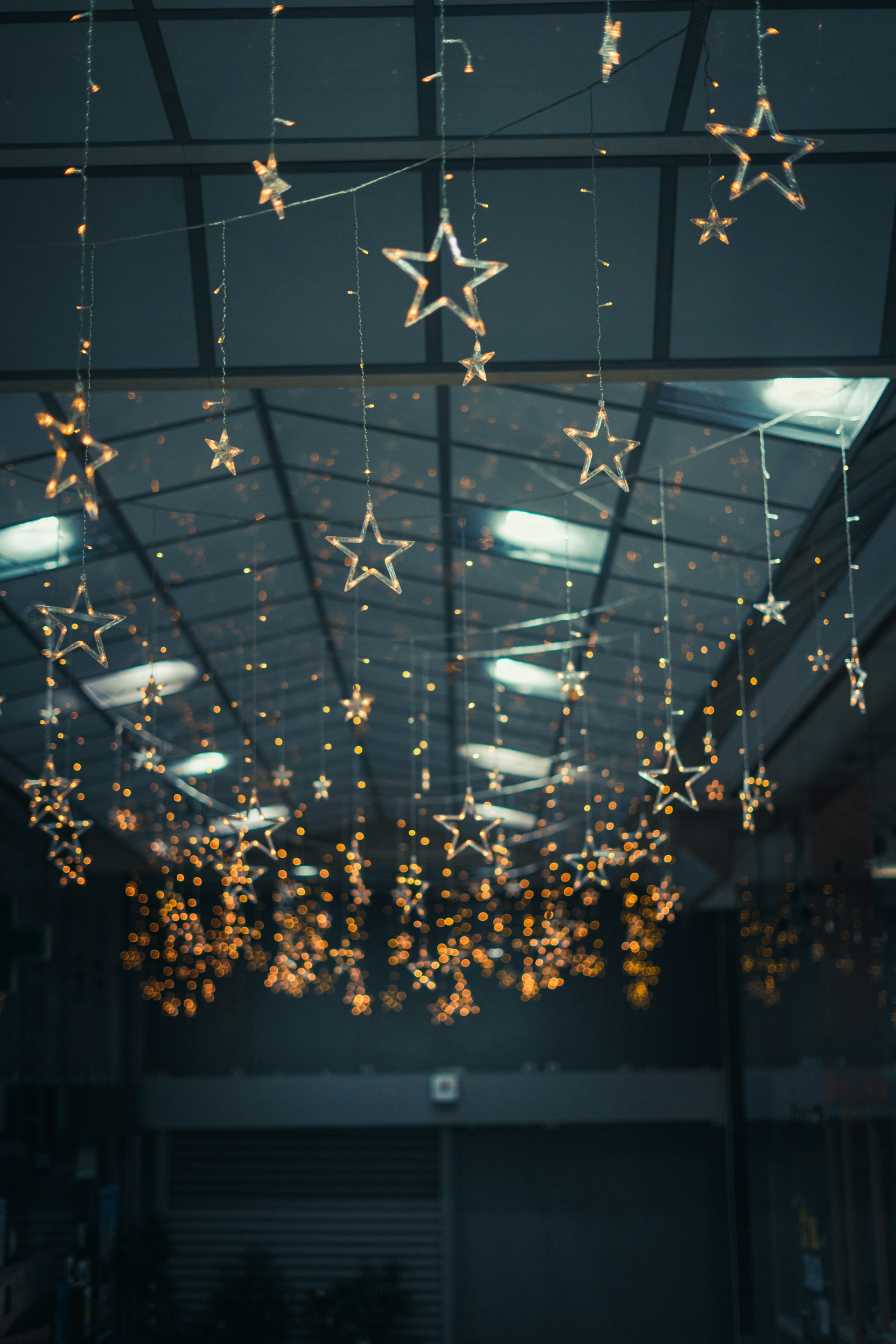 a room filled with lots of stars hanging from the ceiling