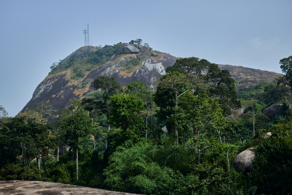 a mountain with a radio tower on top of it