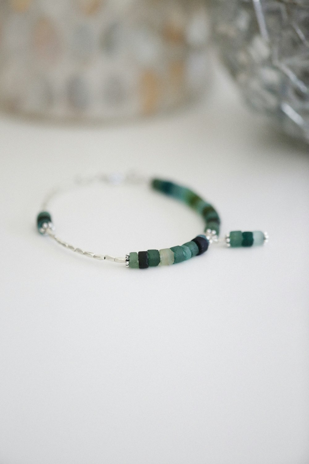 a close up of a bracelet on a table