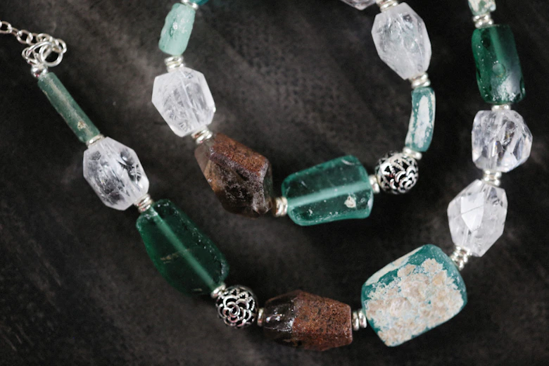 a close up of a necklace on a table