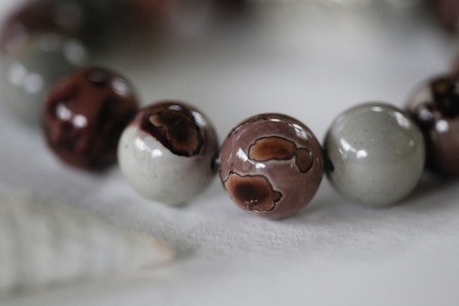 a close up of a bracelet with beads