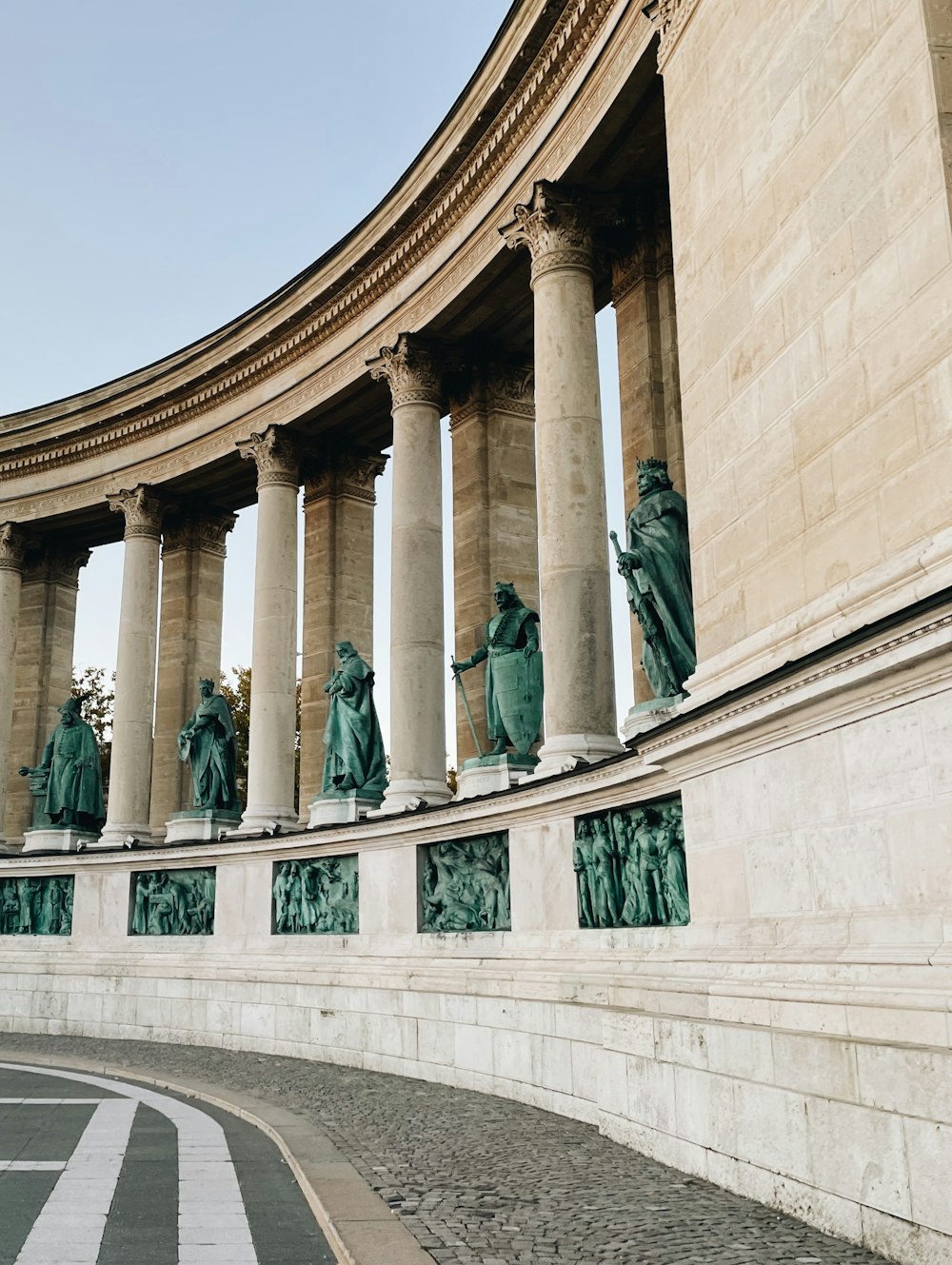 a group of statues on the side of a building