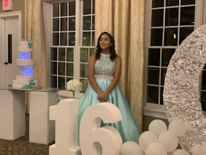 Young woman celebrating her quinceañera with vibrant decorations.