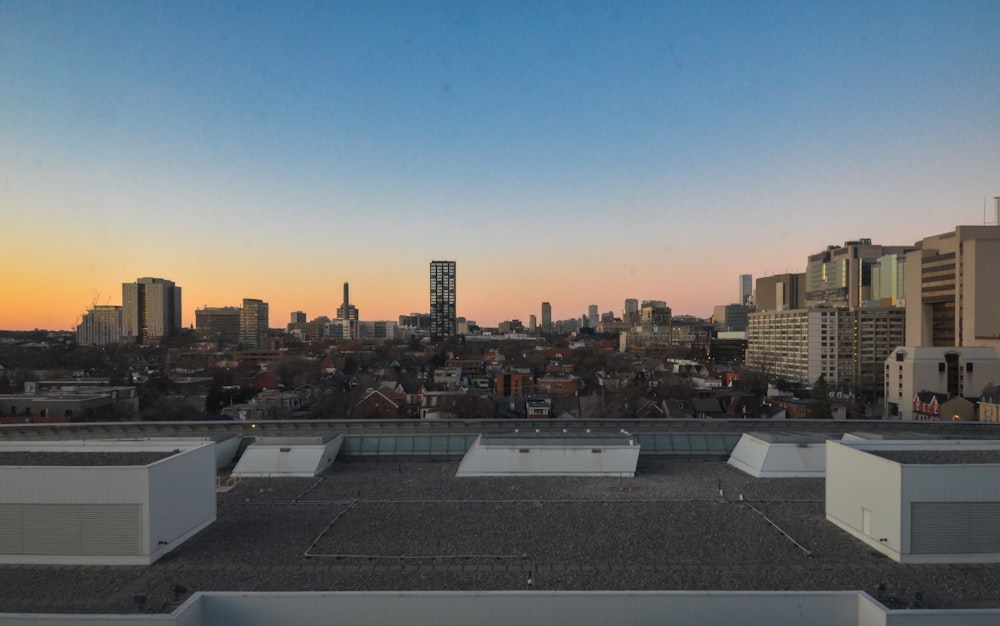 a view of a city skyline from a rooftop