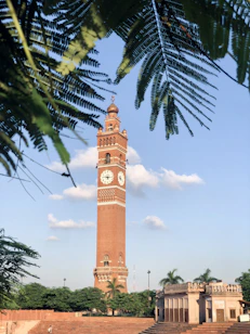 a tall tower with a clock on the top of it