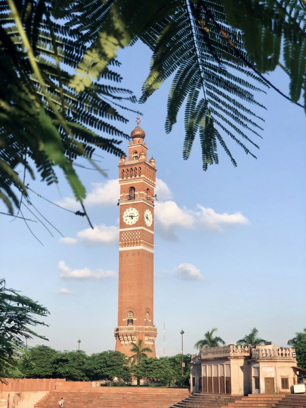 a tall tower with a clock on the top of it