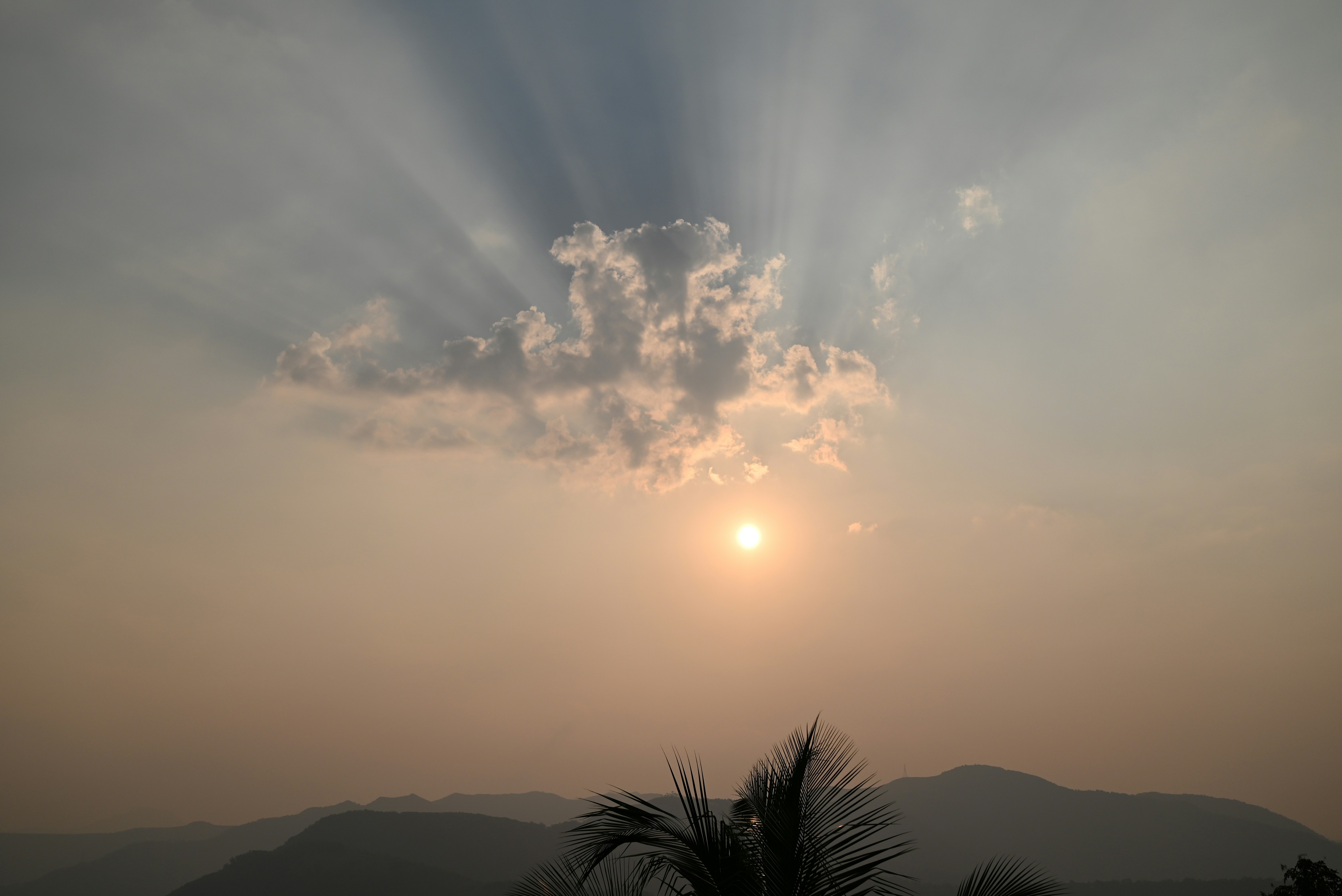 the sun is shining through the clouds in the sky