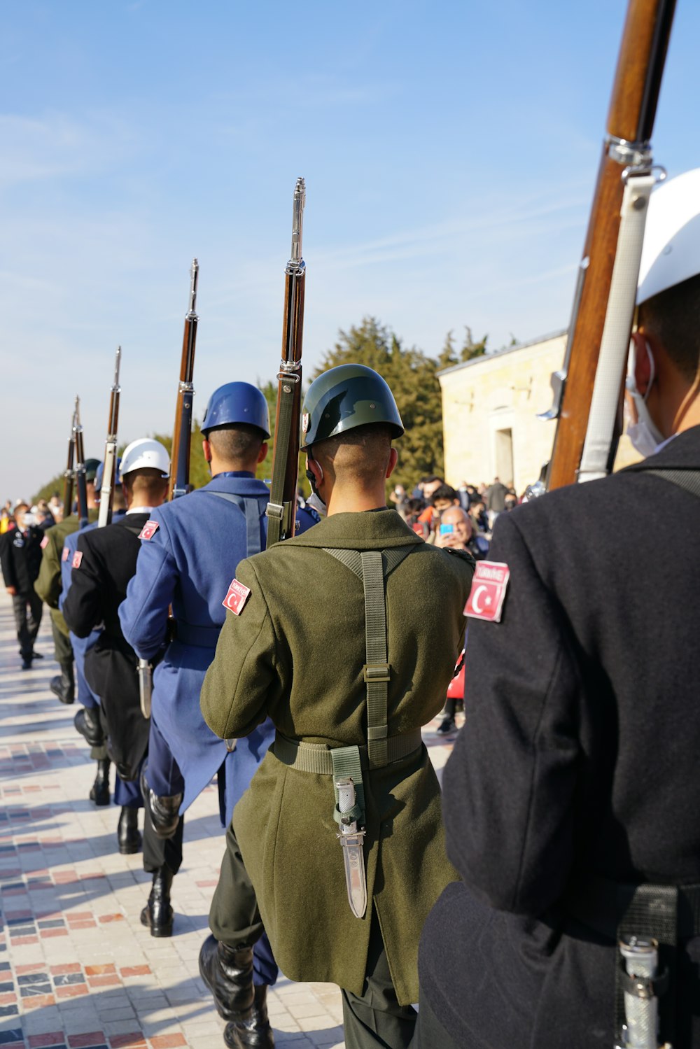 a group of soldiers marching down a street