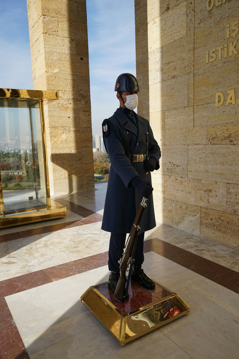 a statue of a man in uniform holding a rifle