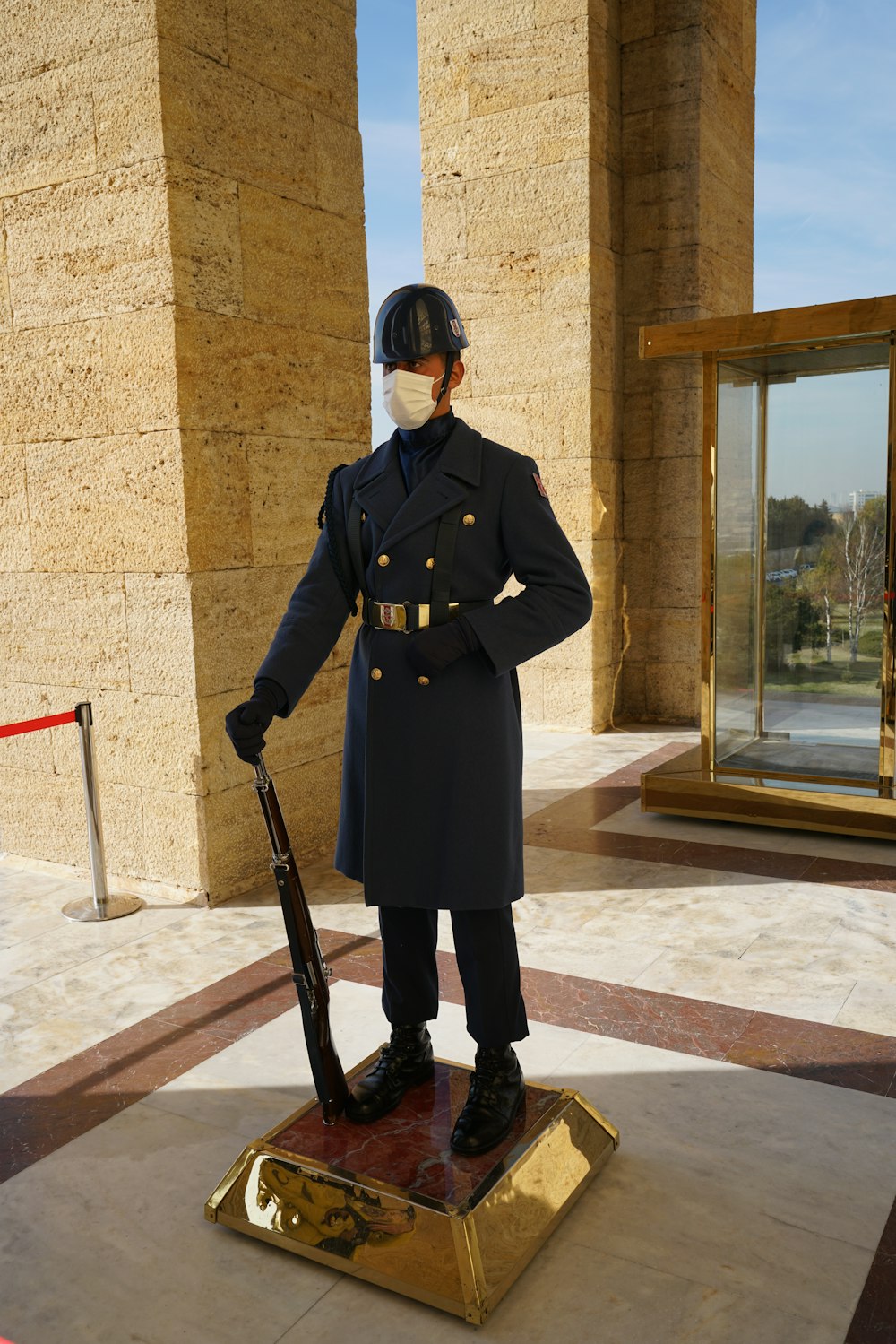 a statue of a man in a military uniform holding a rifle