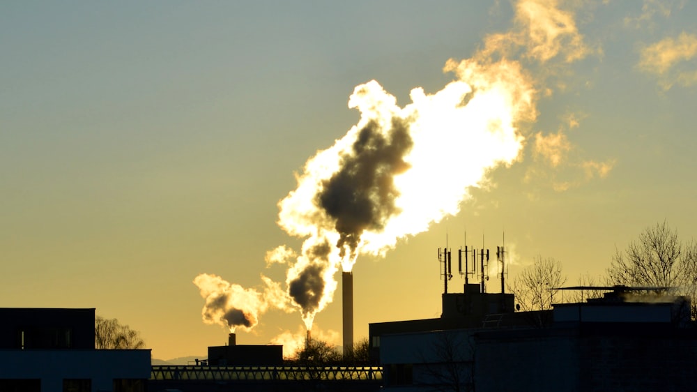 a factory with smoke coming out of it's stacks