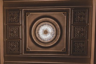 Delicate plaster rosette with classic Louis XVI style, perfect for ceiling decoration.