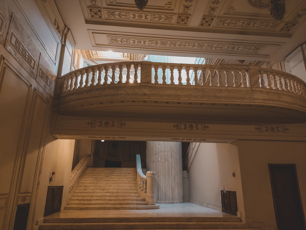 a staircase in a large building with a skylight above it