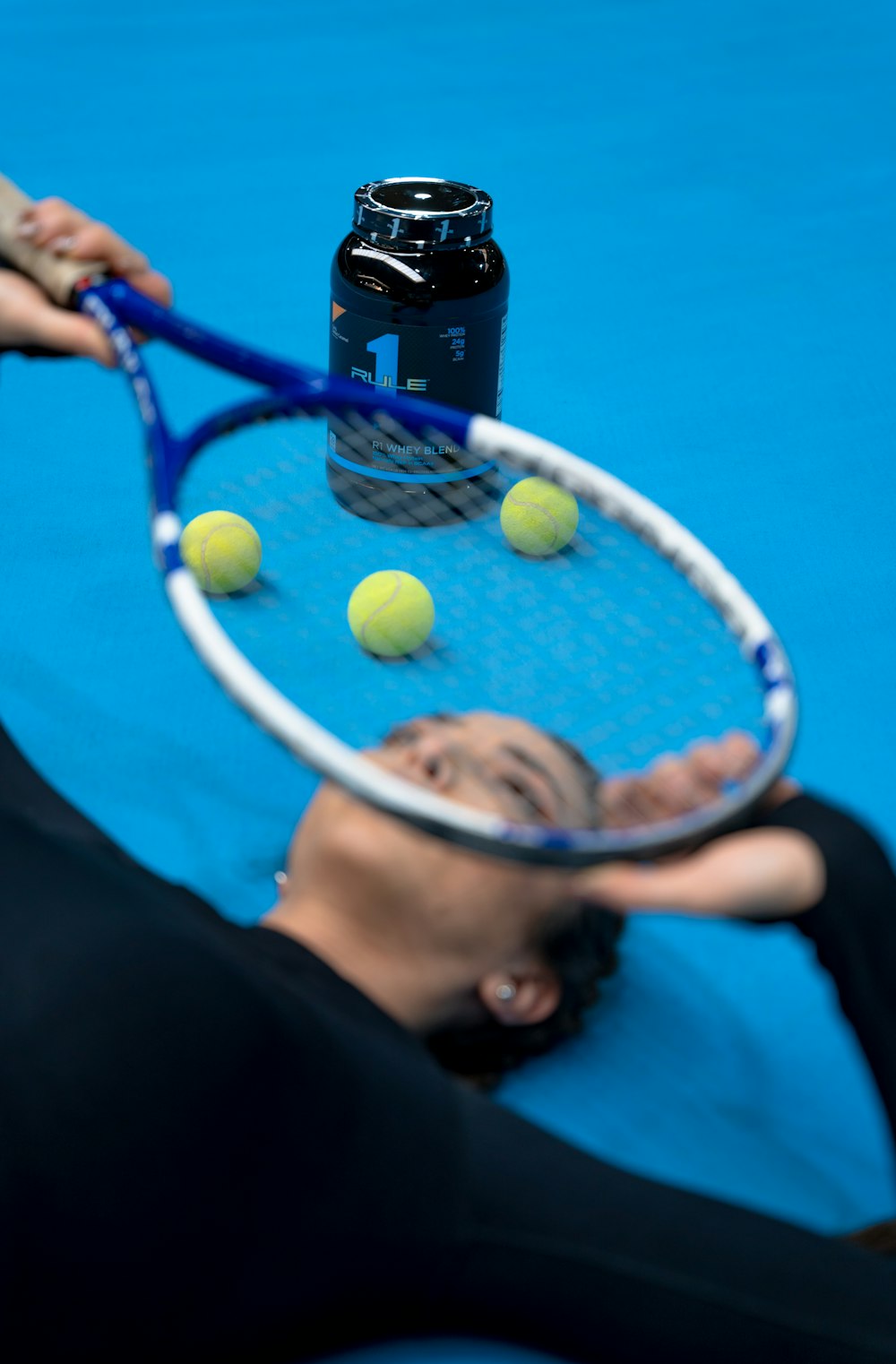 a person swinging a racket at a ball