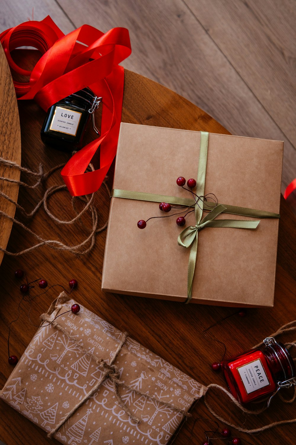 a wrapped present sitting on top of a wooden table