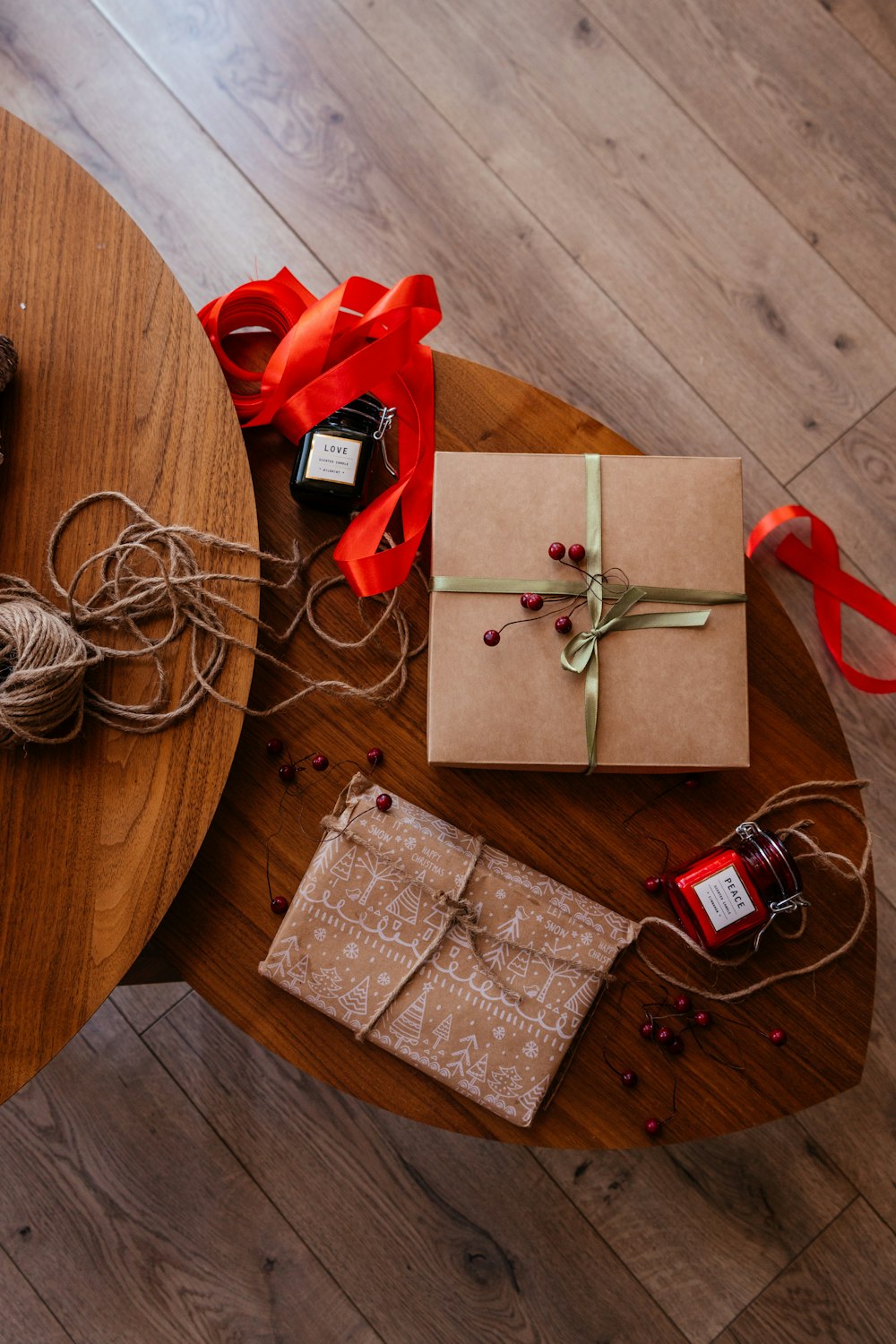a wooden table topped with a wrapped present