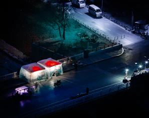 Nighttime view of a Securesight Mobile trailer illuminating a neighborhood street with its security lights