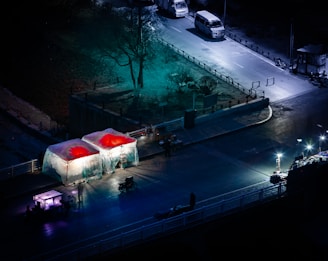 A dynamic snapshot of volunteers distributing care packages under glowing city lights.