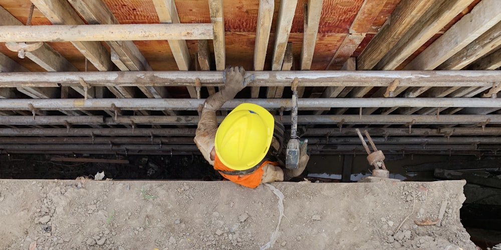 a construction worker with a yellow helmet on