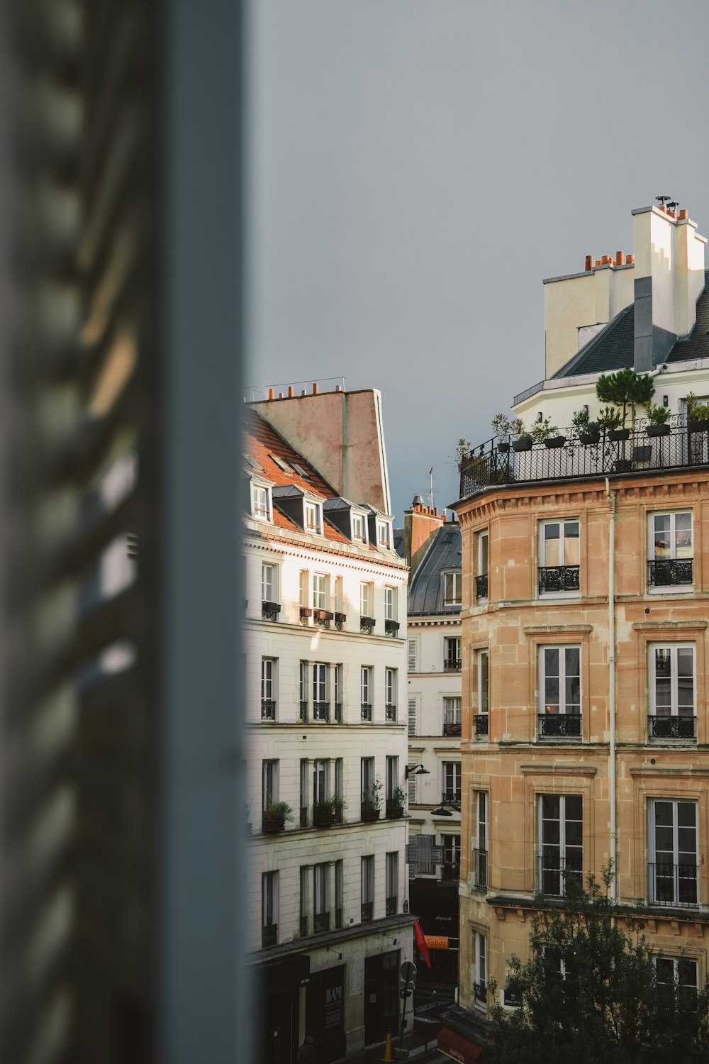 a view of some buildings from a window