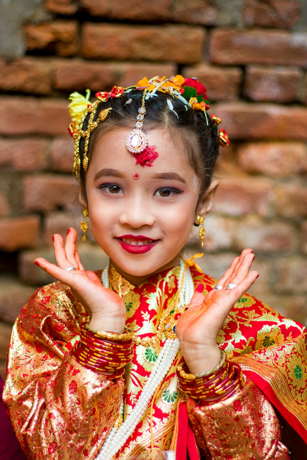 a young girl dressed in a traditional chinese costume