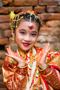 Vibrant kids’ ethnic wear set with playful patterns and bright colors on a cheerful child model.