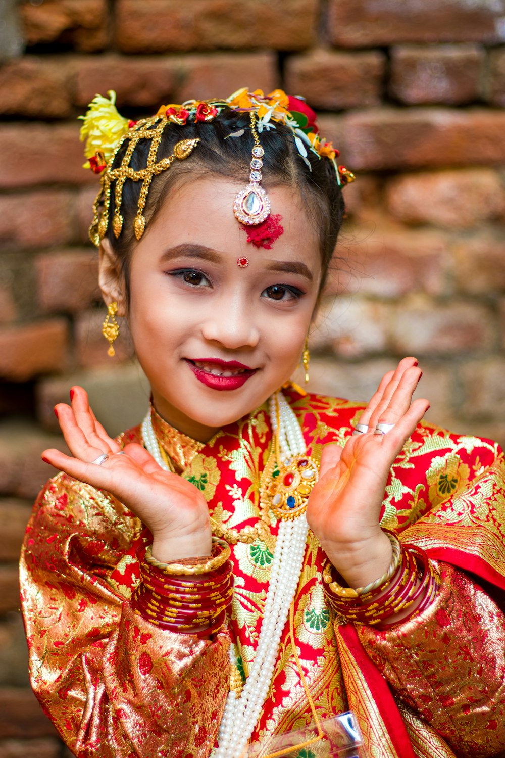 a young girl dressed in a traditional chinese costume