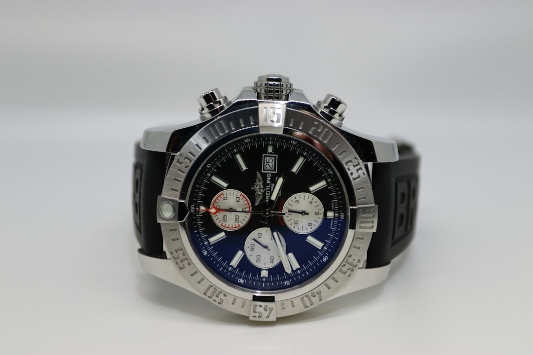 a watch on a white surface with a white background,
