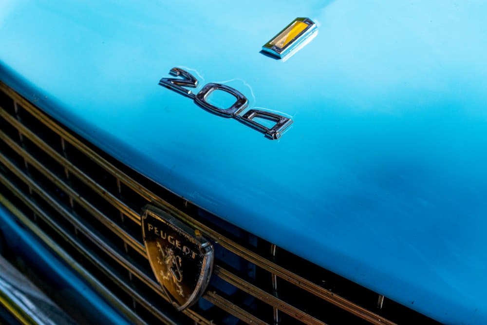 a close up of the front of a blue car