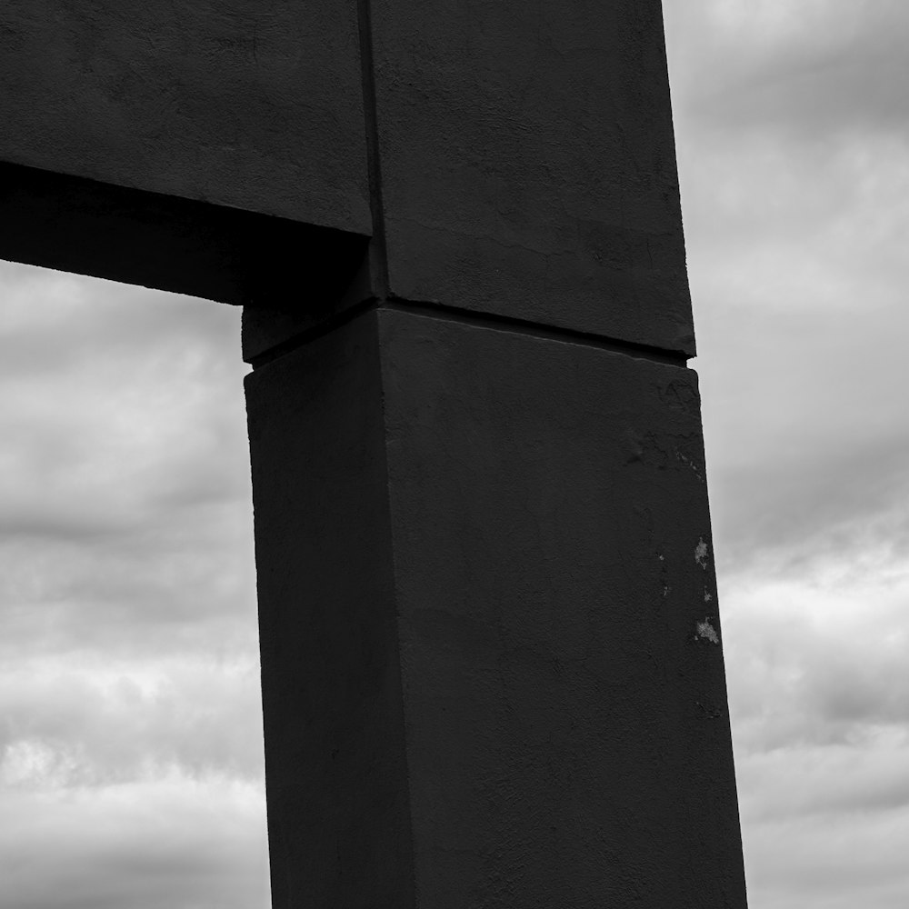 a black and white photo of a tall structure