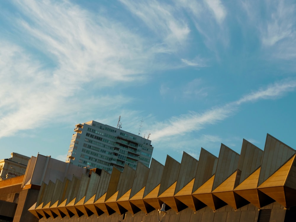 a tall building with a sky in the background