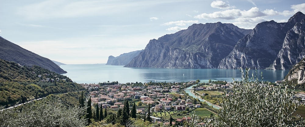 a scenic view of a town and mountains