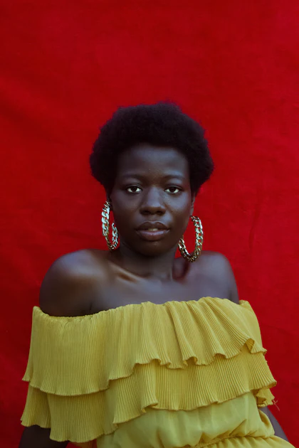 Woman in yellow ruffles on red