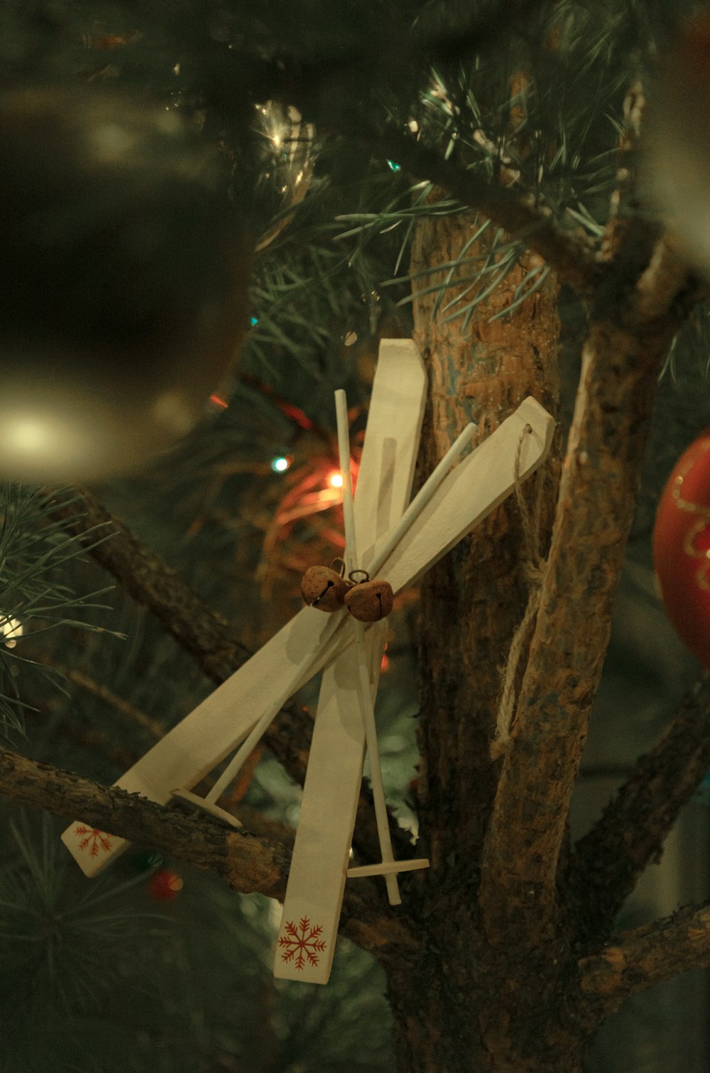 a close up of a cross on a tree