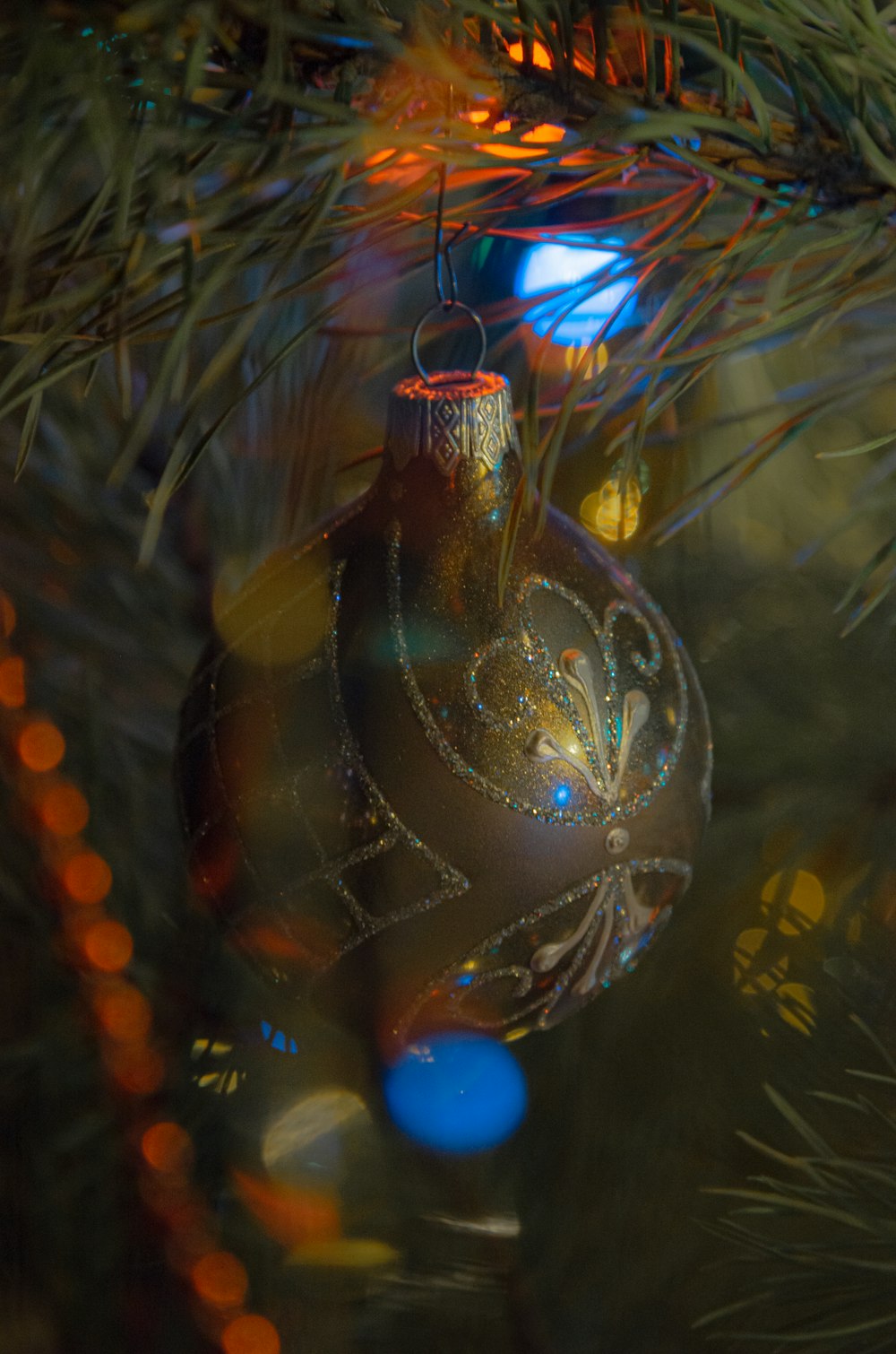 a close up of a christmas ornament on a tree