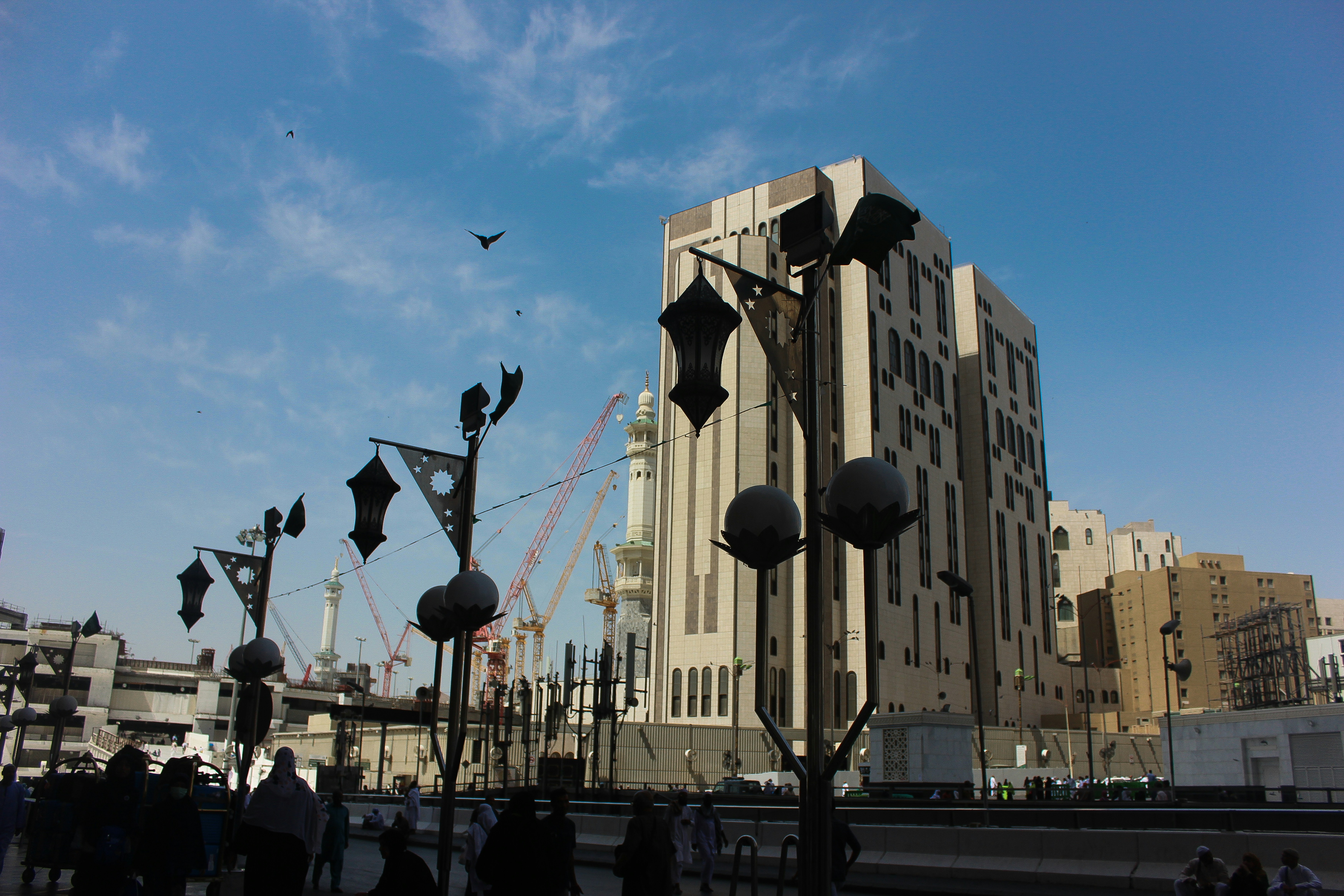 a large building with a tall clock tower in the background