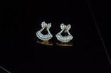 A pair of diamond-studded earrings catching the light beautifully.