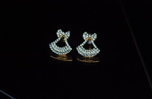 Elegant gold earrings adorned with sparkling gemstones.