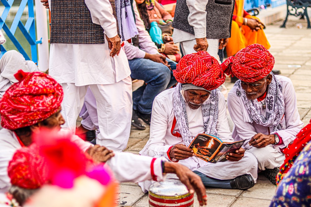 a group of men sitting next to each other