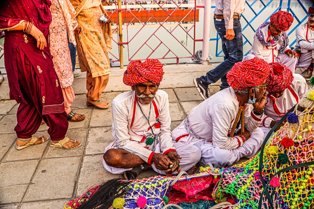 a group of men sitting next to each other